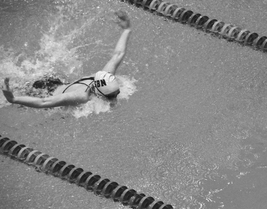 Senior Molly Obon swims the butterfly stroke to a 10th place finish in the 200 yard indvidual medley at the IHSA state meet on Nov. 17. Orbon and fellow senior Christina Park were part of the 200 yard medley team that finished in ninth place with a time of 1:48.08. Photo by Zach Zilber