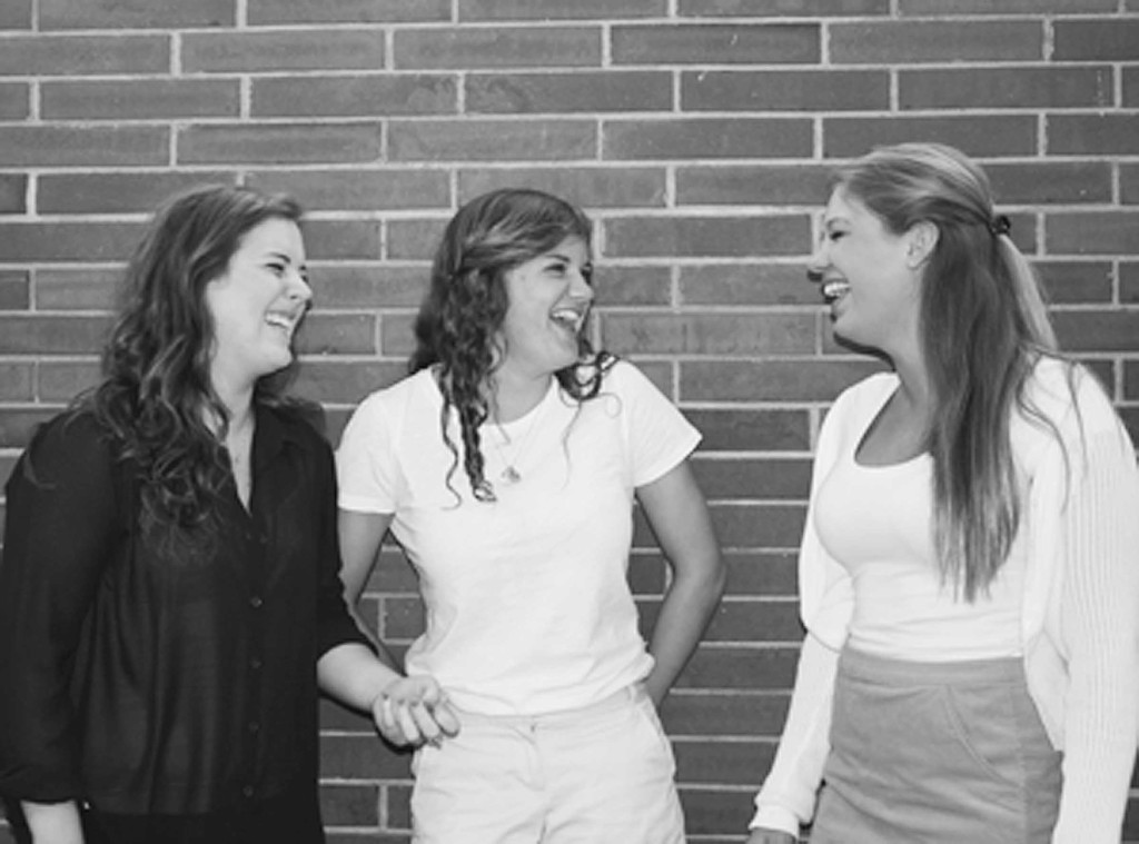 Seniors MaryBeth Schwall (left), Grace Ruklick (middle), and Margaret Dewey (right) laugh as they reminisce about high school memories. Photo illustration by Alexi Rabin