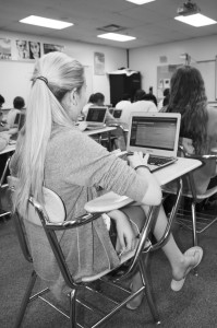 Freshman Molly Sauser works on her homework during her Student Resource Time. “[Chromebooks] are nice and easy to use so you can finish your homework and type your documents,” Sauser said. Photo by Brooke Schwartz.