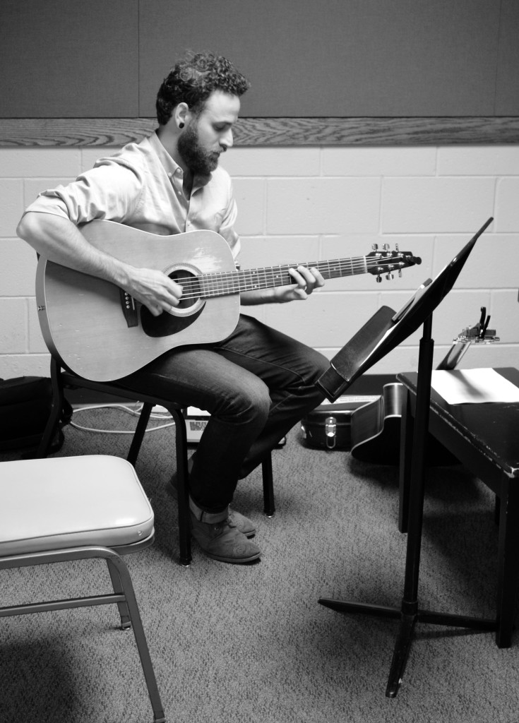 Alumnus Todd Kessler (‘00) practices guitar before he teaches a lesson. Kessler was on season three of “The Voice” and decided to return to Glenbrook North to teach. By Gabe Weininger.