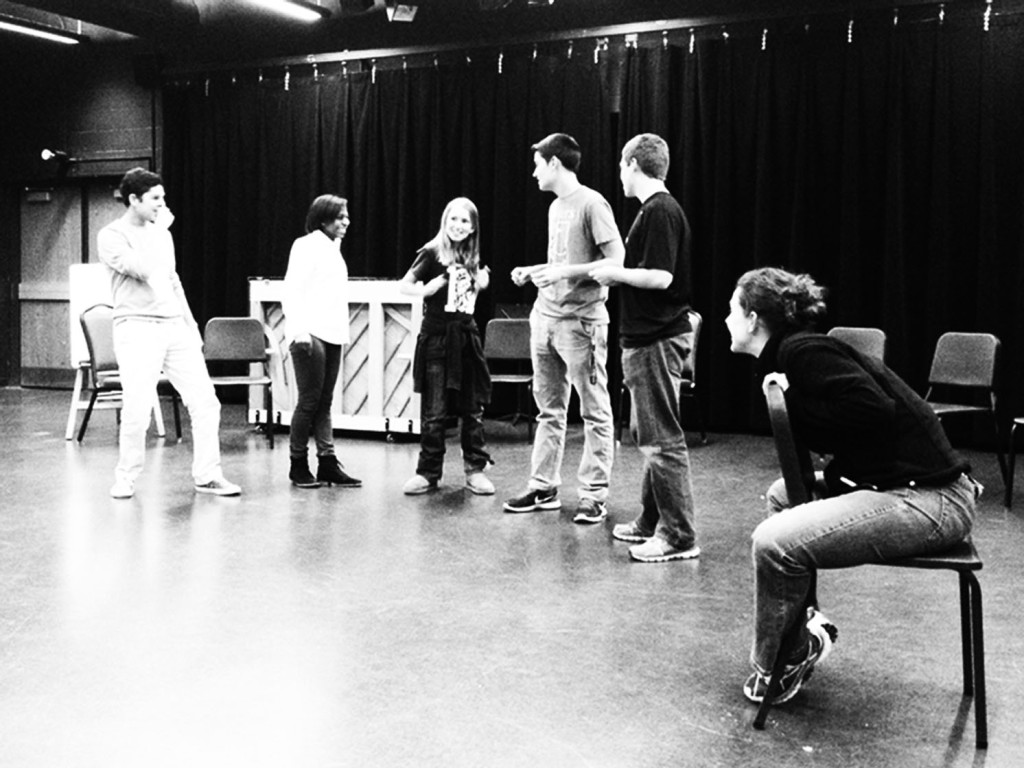 Drama teacher Julie Ann Robinson watches student performers practice for Comedy Sportz with the improvisational game “Beastie Rap.” Photo by Nicole Favia.