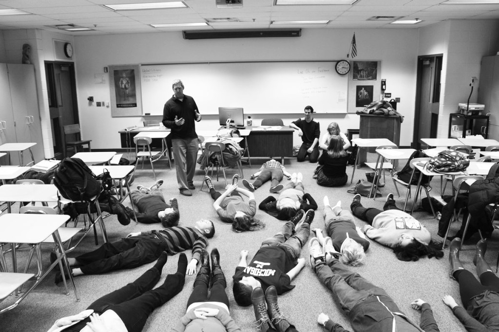 Sponsor Jon Robin Walker instructs the Meditation Club during a meeting on Feb. 19. Meditation techniques practiced included visualization and relaxation. Photo by Julia Kahn.