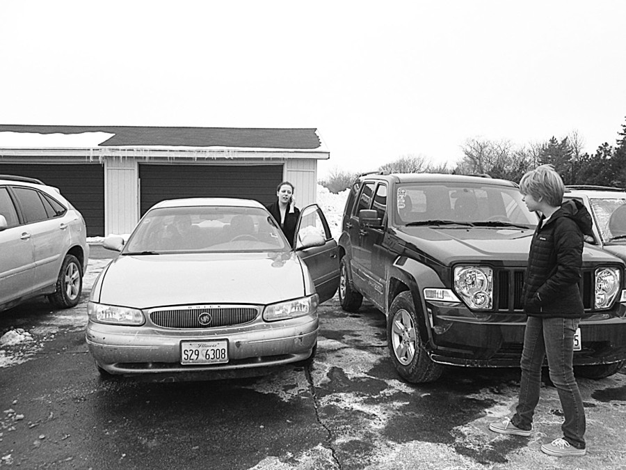 Junior Toby Klein (left) demonstrates Safe Rides standard procedure in picking up students in need of transportation. Klein was one of those who brought the program to Northbrook. Photo by Julia Kahn.