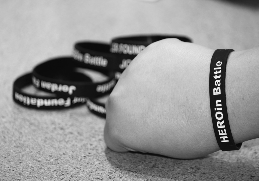 Through the distribution of bracelets, the Jordan Michael Filler Foundation spreads awareness about the dangers of heroin. According to Filler’s aunt Lisa Aronson, the slogan can be read as both “HEROin Battle” and “HERO in Battle.” Photo illustration by Victoria Tu.