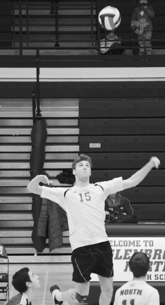 Junior Rob Chatterton jumps for a spike during the first set of a match against Mundelein on March 7. He was named one of the top 30 players to watch in Illinois varsity volleyball by the Chicago Sun-Times’ High School Cube. Photo by Gabe Weininger.