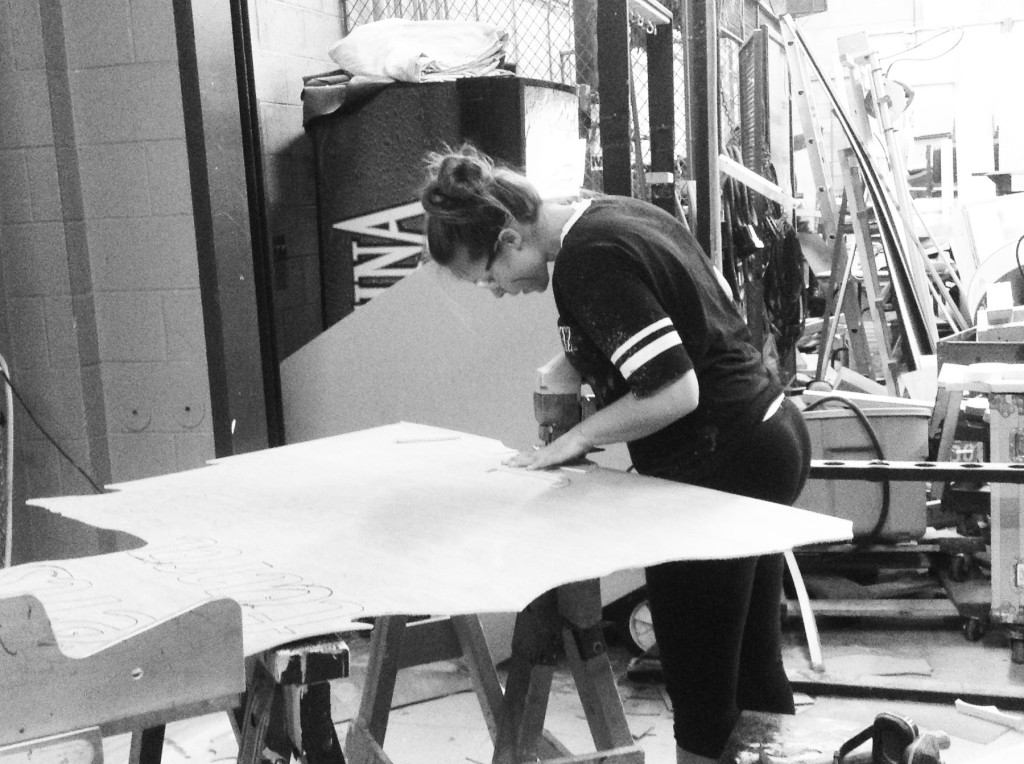 Senior Danielle Shavitz works on construction for the musical “Legally Blonde.” Crew jobs range from makeup to sound, and most crew members receive the chance to try different tasks. Photo by Isabel Hubeny.