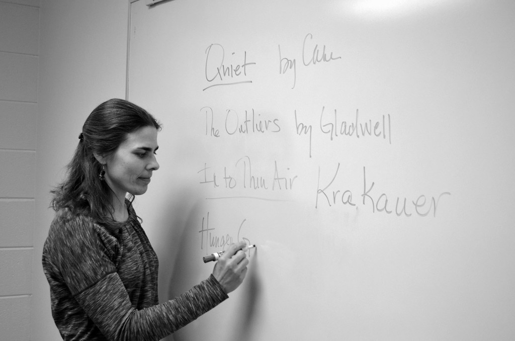 English teacher Kerry Galson encourages reading outside of school by writing titles of books on the board. Not all English classes require students to read for pleasure. Photo Illustration by Gabe Weininger