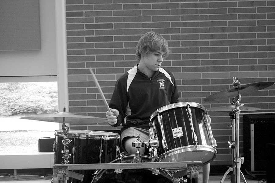 Senior Eric Doar plays the drums after his Glenbrook North Symphonic Band rehearsal. Doar’s schedule consists of concert and jazz bands, hockey and his band, Bullfights on Acid. Photo by Morgan Berg