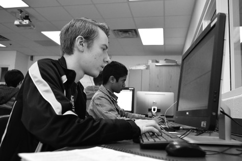 Senior Danny Martens works on coding problems in Glenbrook South’s AP Computer Science class. Glenbrook North has not offered the class since 2009. Photo by Meghan Cruz.