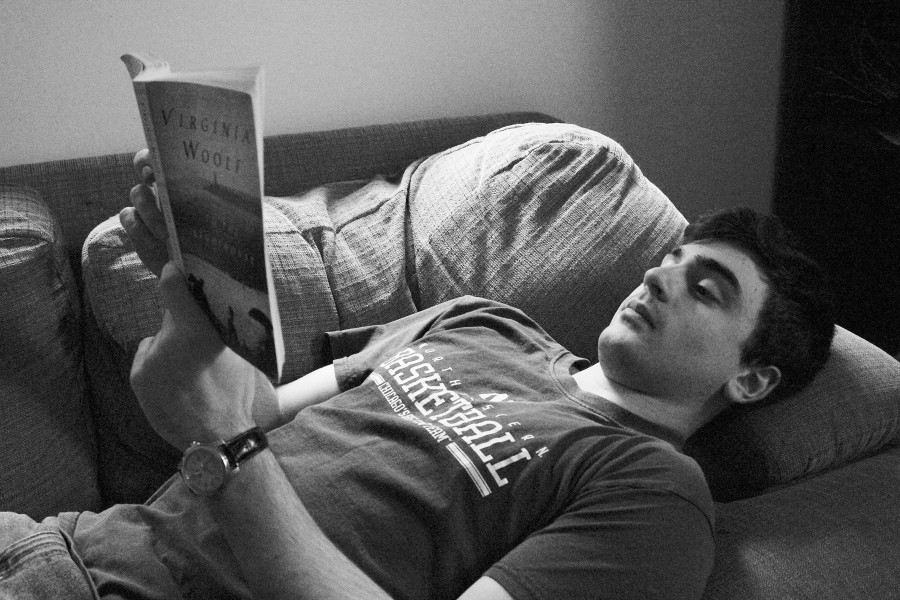 Senior Ben Hunt chooses to read paper books two or three nights during the week before bed. He said he falls asleep easier when he does not look at screens before he goes to sleep. Photo Illustration by Alec Mawrence
