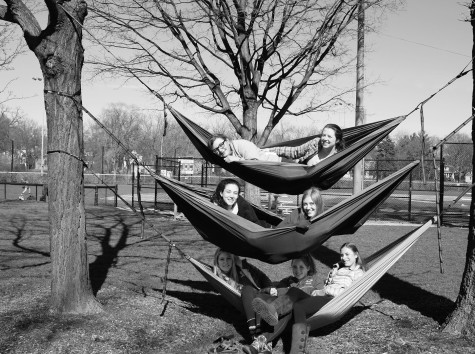 Members of the Venture Crew lounge in hammocks at the Village Green before meeting at St. Norbert’s to plan their next trip. Together, they have gone camping in Wisconsin, luging in Michigan, hiking, cross country skiing and rock climbing. Photo by Sydney Stumme-Berg