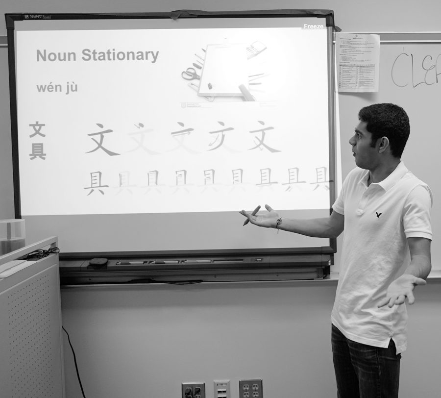 Executive News Editor Sahil Modi gets lost in the subtleties of the Chinese language during a staged vocabulary presentation. Although his pronunciation has improved since freshman year, he values the friends made more than the words learned. Photo by Richard Chu