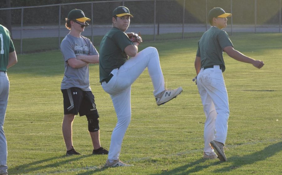 Winding up, senior Eric Orloff practices his pitching. Orloff and the varsity boys baseball team have been involved in off-season training throughout September. Photo by Natalie Sandlow