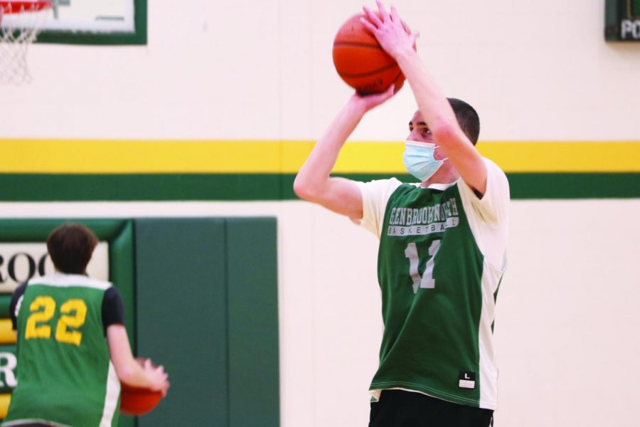 Sophomore+Ryan+Cohen+warms+up+for+a+GBN+basketball+practice+on+Feb.+18.+Cohen+played+in-state+tournaments+with+his+travel+basketball+team+and+currently+plays+for+boys+varsity+while+learning+in+person.+Photo+by+Alex+Garibashvily