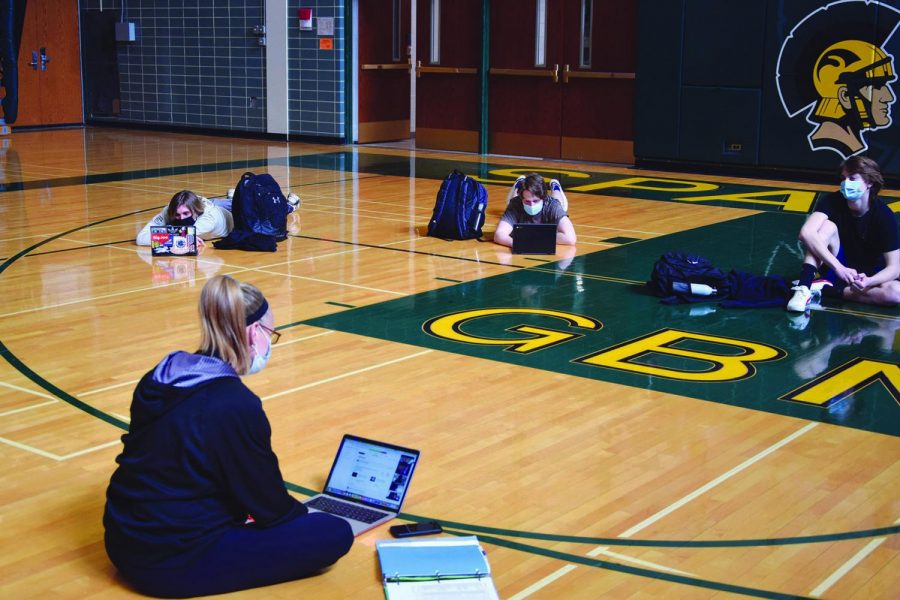 During SEL instruction in P.E. teacher Jennifer Schultzs Sports and Fitness class, students watch a video emphasizing resilience and courage. SEL should remain in P.E. curriculums and include extended instruction on mental health, discussion in small groups and opportunities to listen to others experiences. Photo by Natalie Sandlow