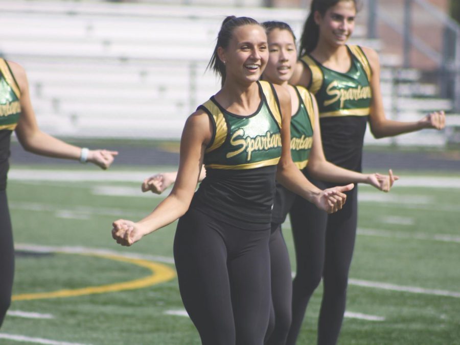 Senior Maria Roches performs during the Loyalty Day assembly  on Sept. 10. The varsity poms team in scheduled to compete in IHSA competitive season for the first time in school history once football season ends.  Photo by Jenna Amusin