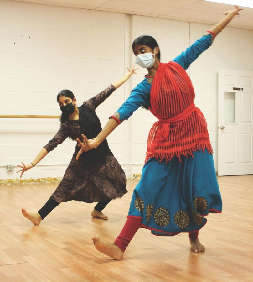 In a duet practice, freshman Emma Kattookaran (left) practices Bollywood dancing. Kattookaran, a member of Nazaare North, was practicing for her upcoming performance at Soorya Dance, an Indian dance and music school.
