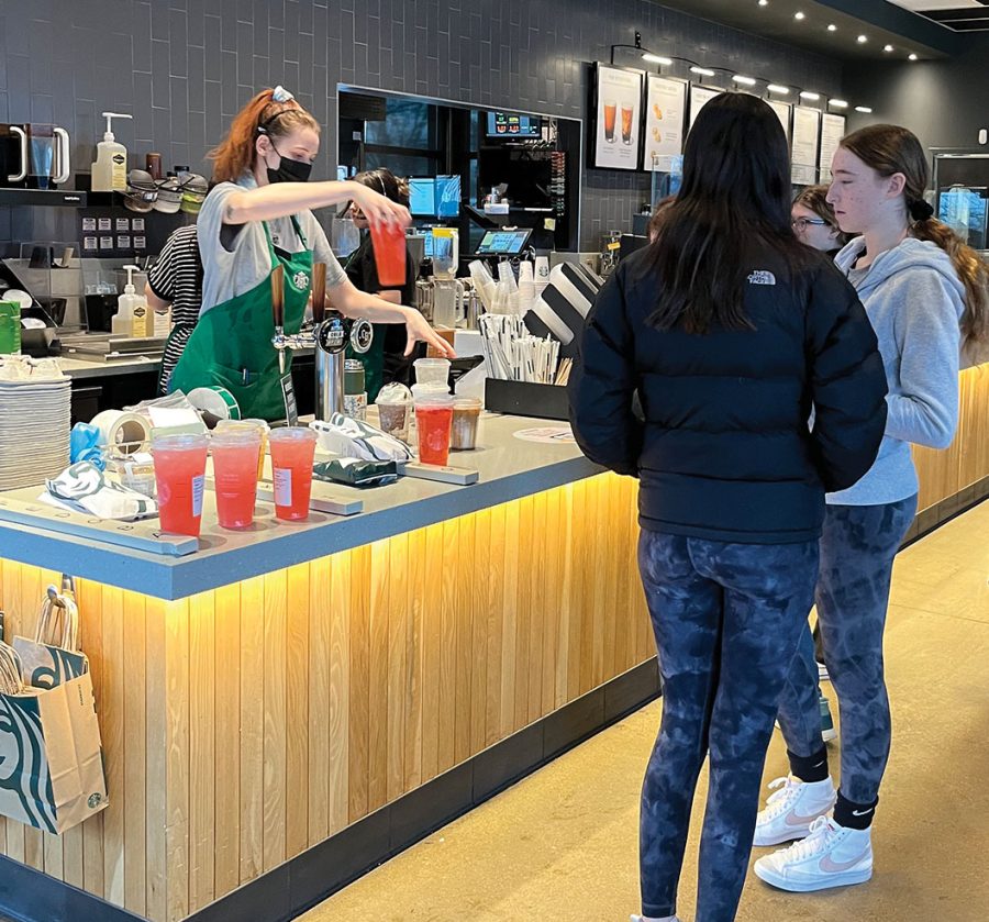 Students+wait+for+their+orders+in+the+Starbucks+on+Willow+Road+and+Pfingsten+Road+during+a+late+arrival+day+on+Feb.+9.+In+part+due+to+staffing+issues+that+make+wait+times+longer%2C+baristas+at+this+location+decided+to+unionize.