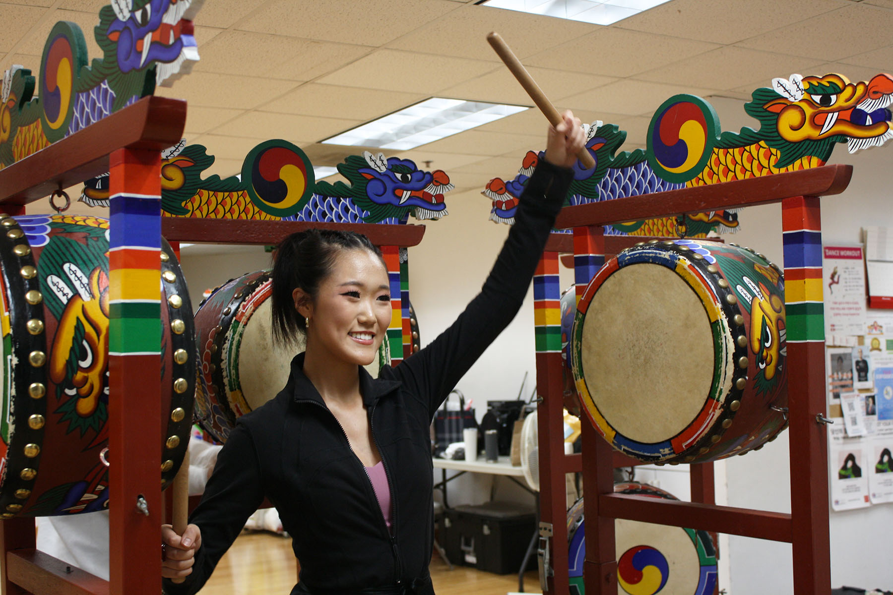 Senior Erica Yoo plays the drums while rehearsing choreography for the Chicago Thanksgiving Parade. Yoo has been performing with the Chicago Korean Dance Company’s youth group since her freshman year.