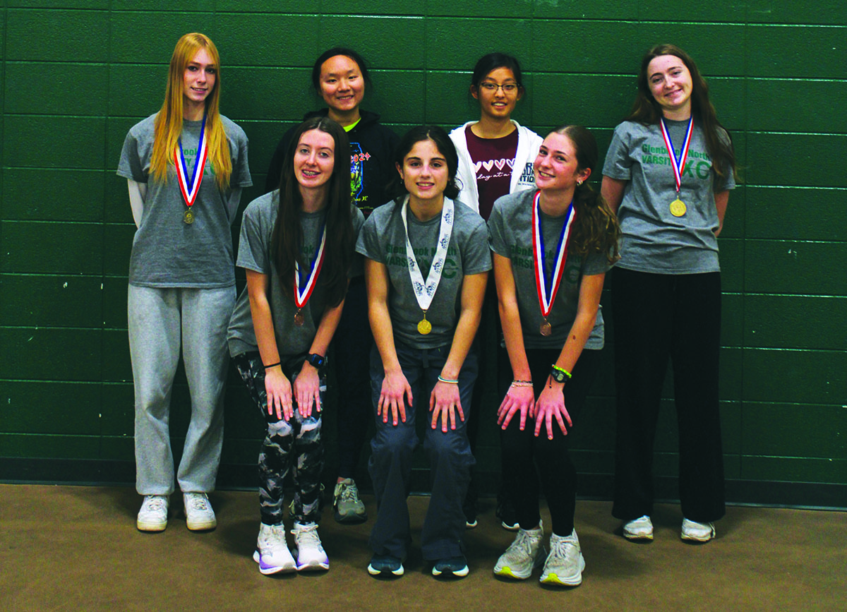 Girls cross country state qualifiers show off their medals after placing 15th at state. The team finished second at regionals, fifth at sectionals and ended with a 5-0 conference record.
