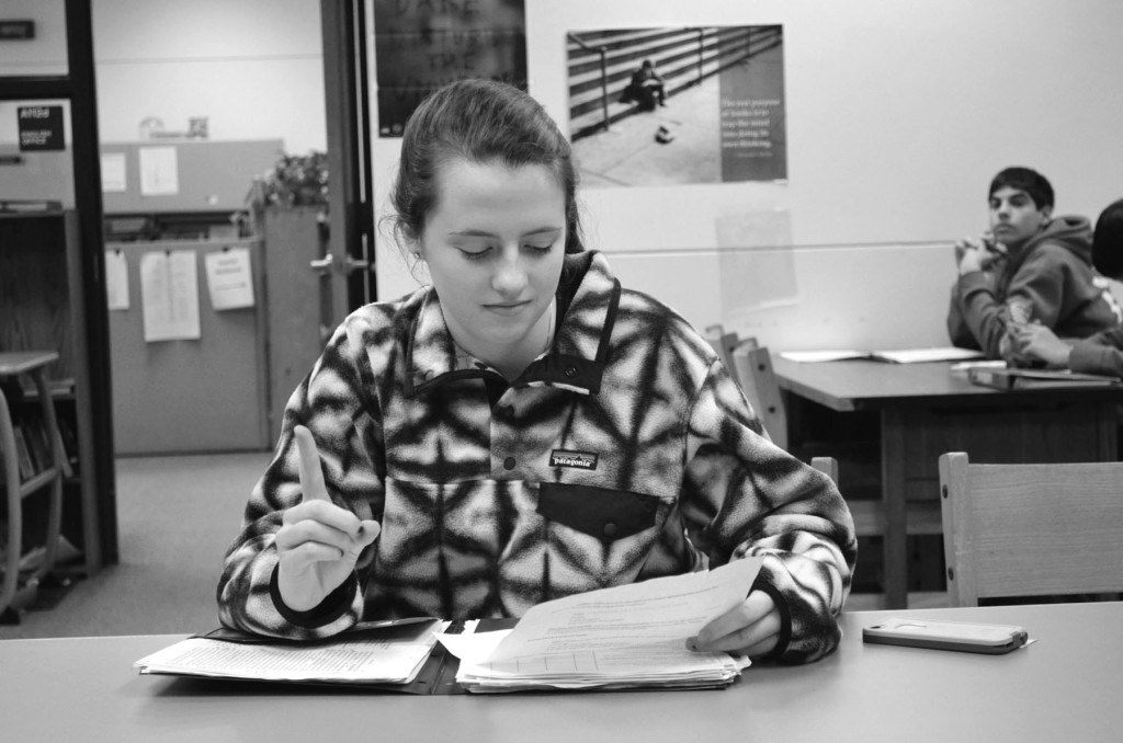 Sophomore Carly Smith uses sign language as a study strategy. She has studied for Spanish tests by using the sign language alphabet to help her memorize the spelling of vocabulary words. Photo by Gabe Weininger