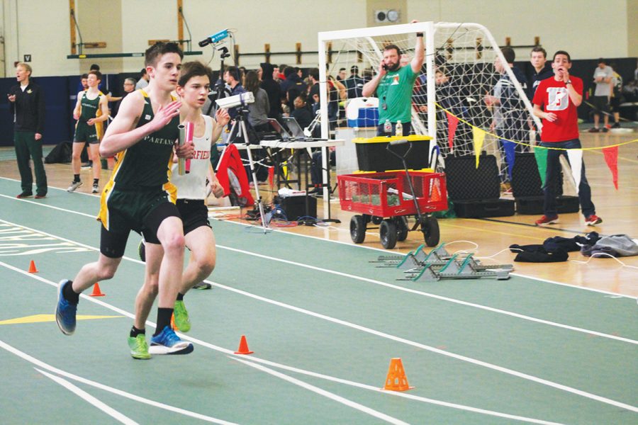 Freshman Patrick Herbst runs a relay at the CSL indoor conference meet on March 15. Beginning with the class of 2022, completing both indoor and outdoor track will not count as two sports towards the 12-Season Athlete Award. For all older athletes, completing both sports counts as two credits towards the award. Photo by Karina Belotserkovskiy 