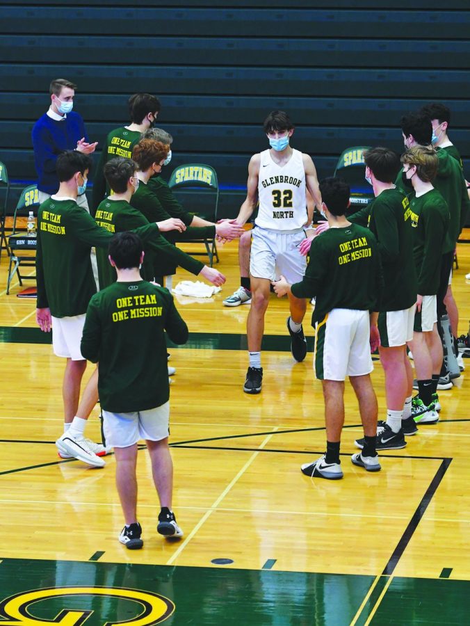 Freshman Patrick Schaller is announced as a starter before his game against Maine West on Feb. 27. Schaller started in all but one game this season. Photo by Natalie Sandlow