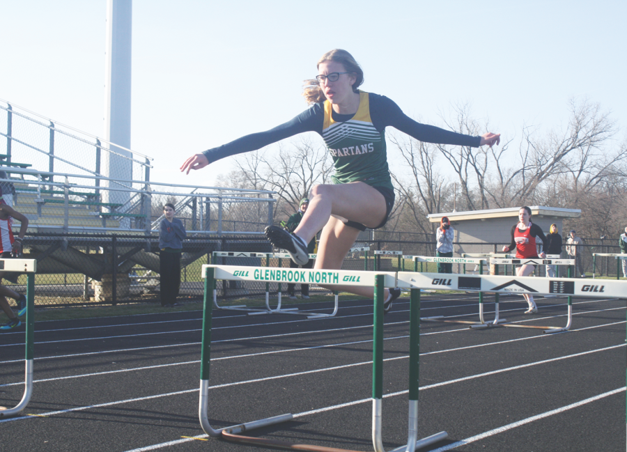 Senior Eva Sadowski competes in a hurdles relay at the Spartan Relays meet on April 1. Her team placed third in the first outdoor meet of the season. Photo by Kate Leverenz