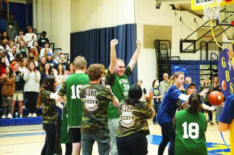 Glenbrook North junior Jacob Stasieluk celebrates after making a basket during the TLS basketball game at Glenbrook South on April 26. After organizing 30 TLS basketball games, TLS teacher Kimberly Fisher plans to retire and hopes to be back next year as a spectator. Photo by James Lee