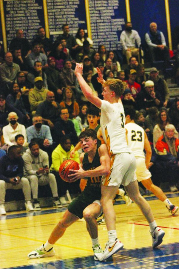 Junior Owen Giannoulias drives to the basket in a game against Glenbrook South on Jan. 6. Glenbrook North won the game 65-57, and the team beat GBS again on Jan. 31. Photo By Jiya Sheth 