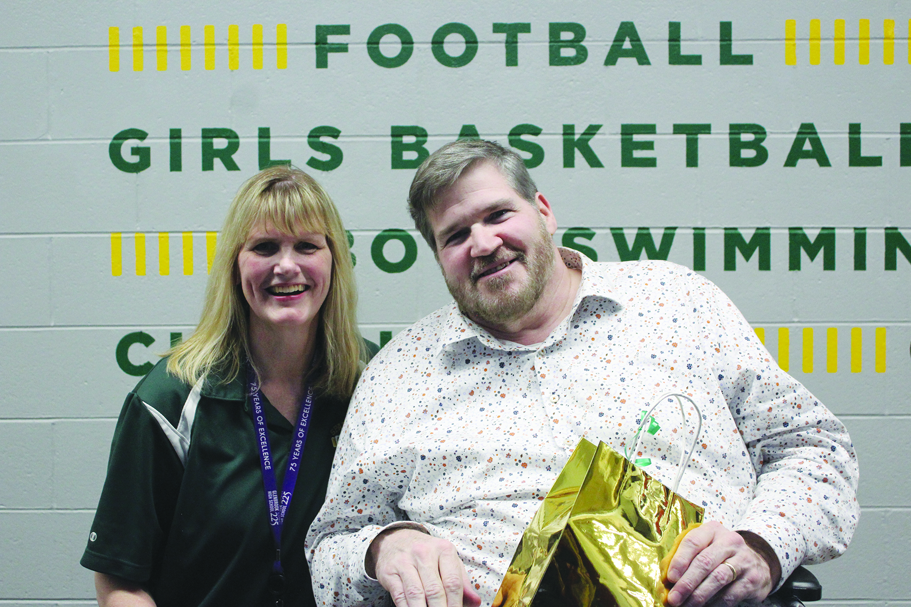 Math teacher Karen Fitzsimons and social studies teacher Jerome Hoynes after receiving recognition for their careers at Glenbrook North during the Pride Assembly.