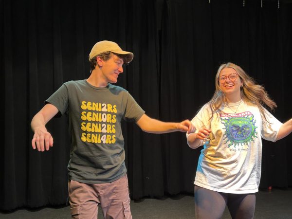 Senior Andrew Burke (left) and junior Maya Spreckman rehearse for their roles in The Prom. Performances of the musical are scheduled to take place from May 1 to May 4 at 7 p.m. in the CPA. Tickets can be purchased online at ShowTix4U (www.showtix4u.com). Photo by Karsten Konstant