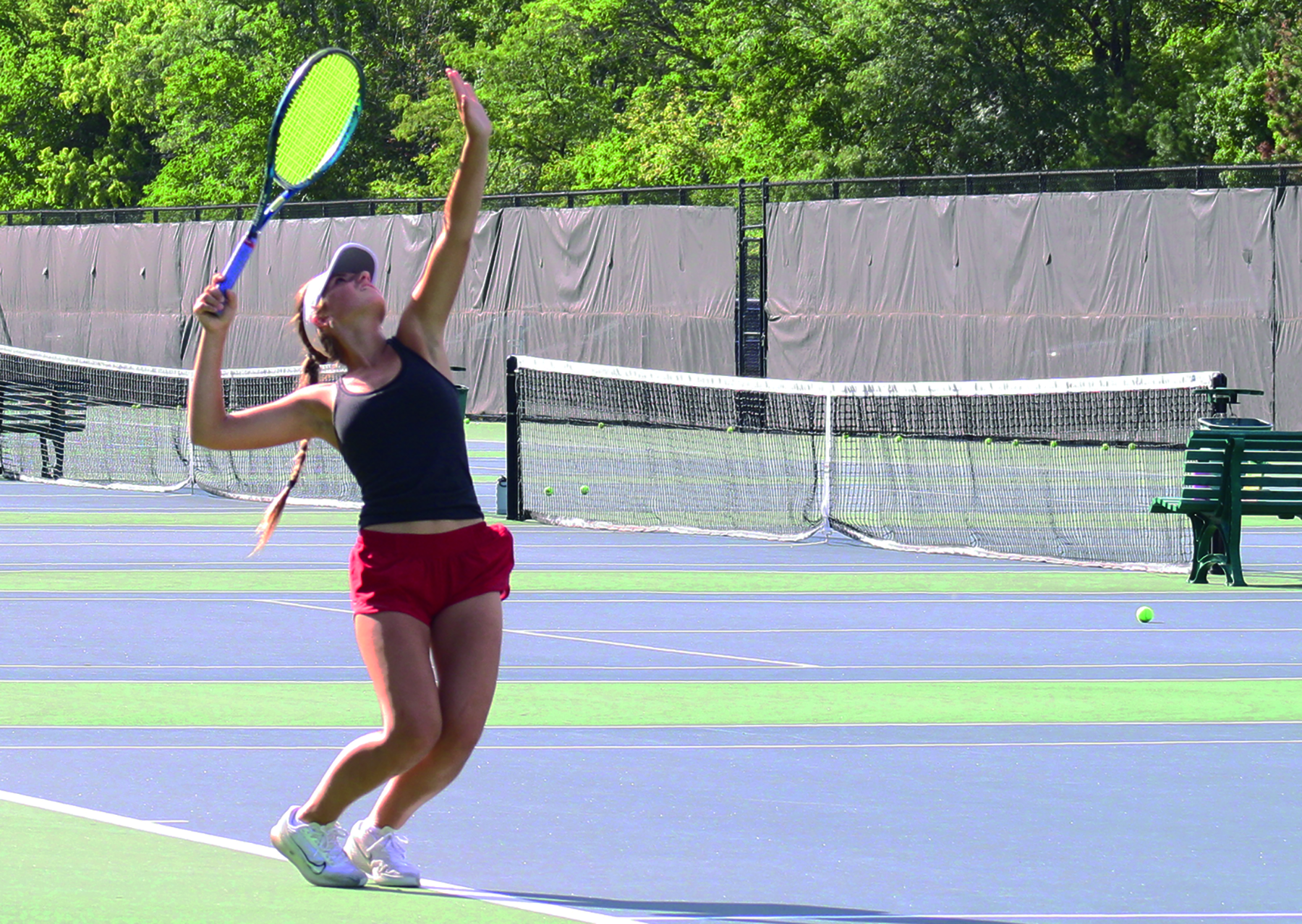 Junior Klaudia Wietecha practices her serve during a varsity tennis practice. Fall sports, like tennis, will begin closer to the start of the school year with the updated calendar.