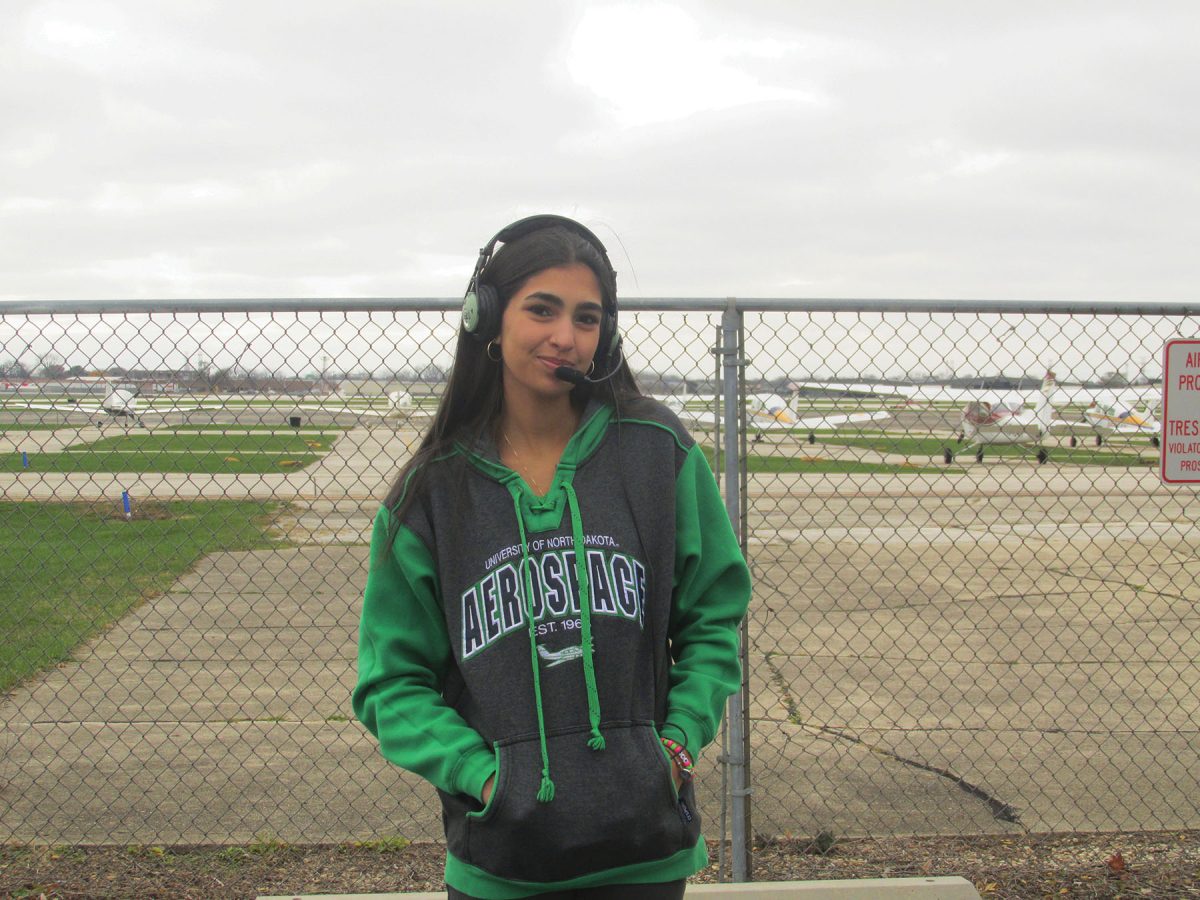 Senior Asha McCaughan stands in front of the airstrip at the Chicago Executive Airport, where she takes flight lessons. McCaughan has been flying planes since Aug. 2023.