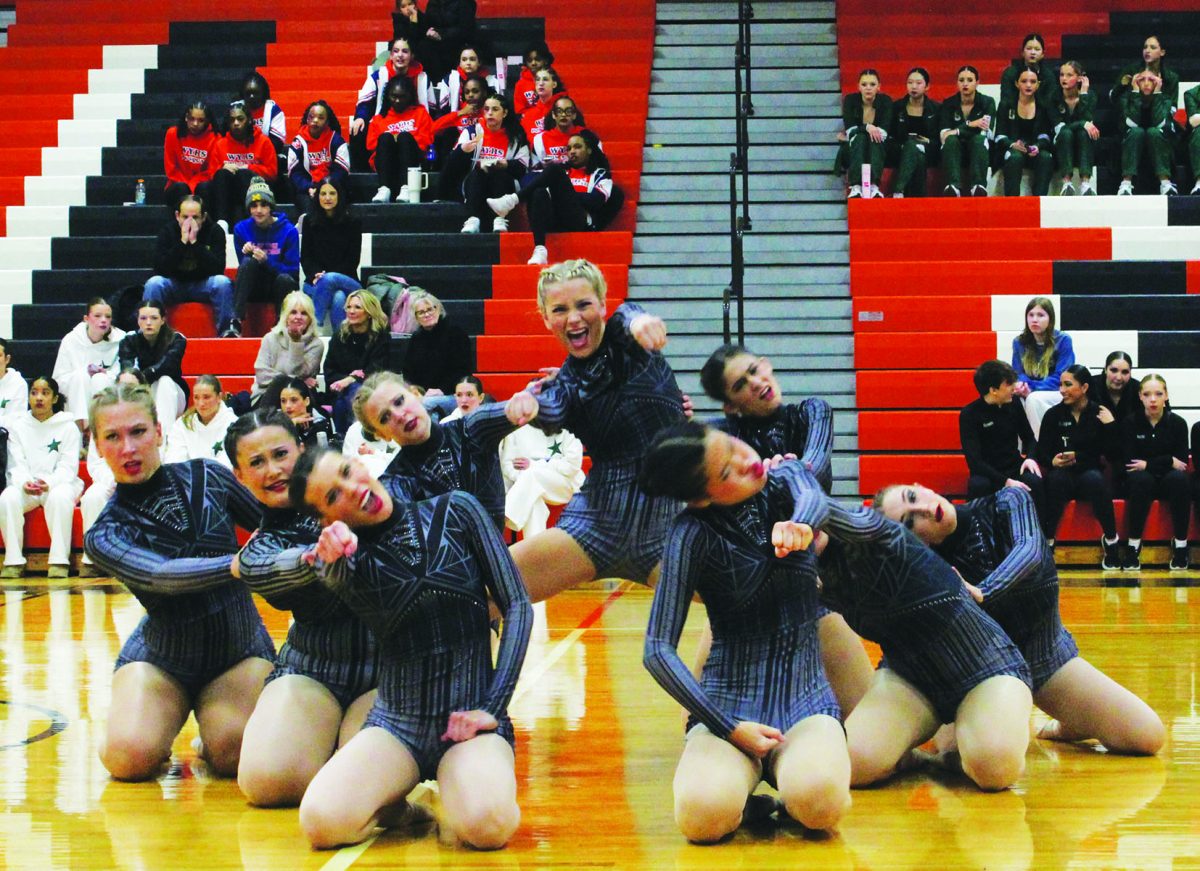 The poms team performing at the sectional competition on Jan. 25. The team finished eighth out of 15 teams. While performing, the team focuses on using facial expressions to convey emotions.