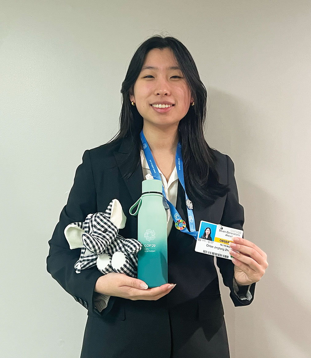 Senior Chloe Zhu holds the stuffed elephant she received after speaking about youth climate activism at the 2024 United Nations Climate Change Conference, also known as COP29. In her speech, Zhu shared her experience drafting an Illinois bill advocating for climate education in schools.