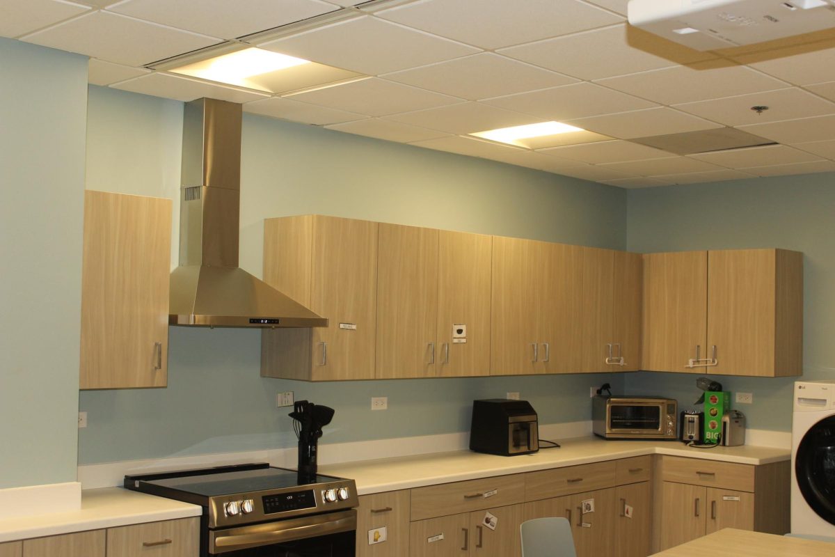 The new location of the Glenbrook Transitions Services Center contains larger facilities for students. In the new residential style kitchen, students can develop life skills like cooking and collaborating with peers.