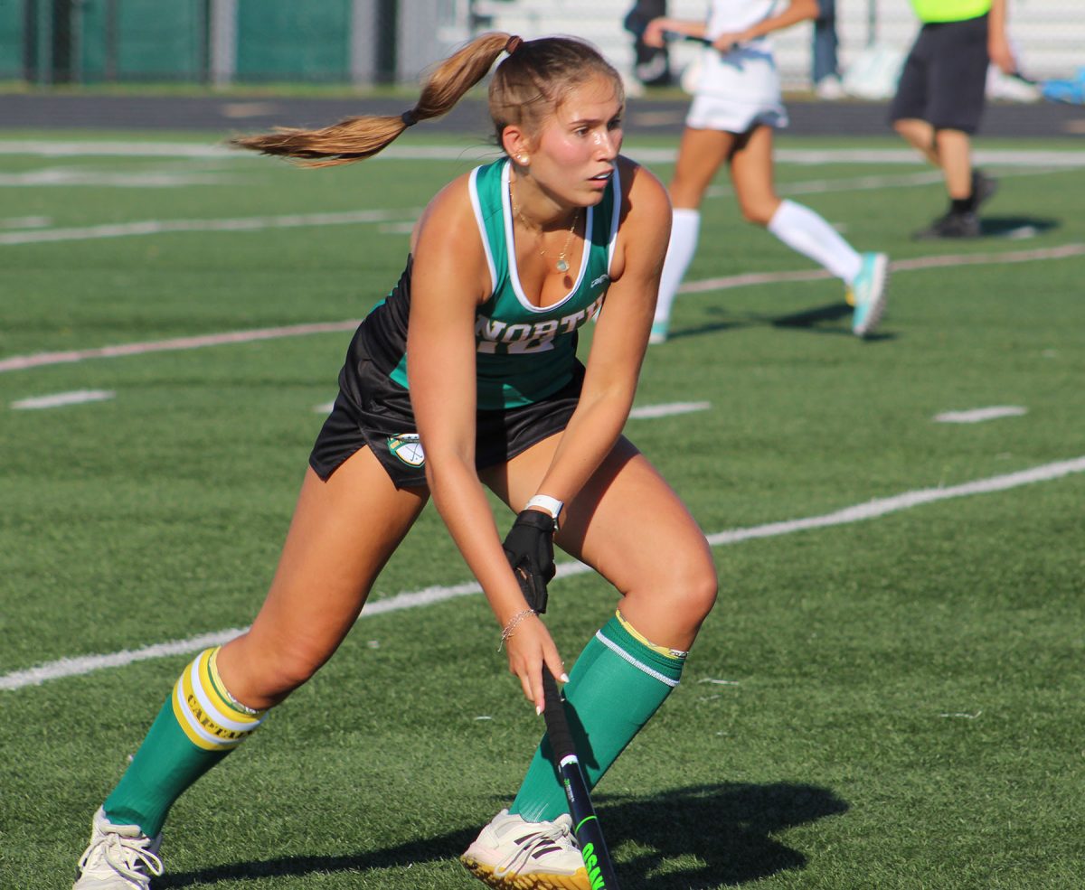 Senior Sophie Wenk dribbles the ball in GBN's home game against Lake Forest on Aug. 26. The Spartans won 3-2.