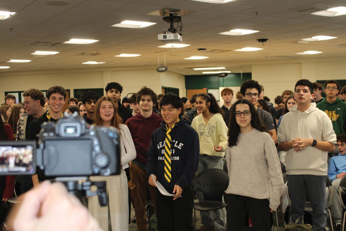 DECA members sing a portion of the Spartan Fight Song at a meeting on Nov. 6. Senior Lexx Malkin felt very grateful to be a part of the DECA community that came together to show school spirit. The video is intended to promote student unity and is scheduled to air at the Loyalty Day Assembly on Jan. 24.