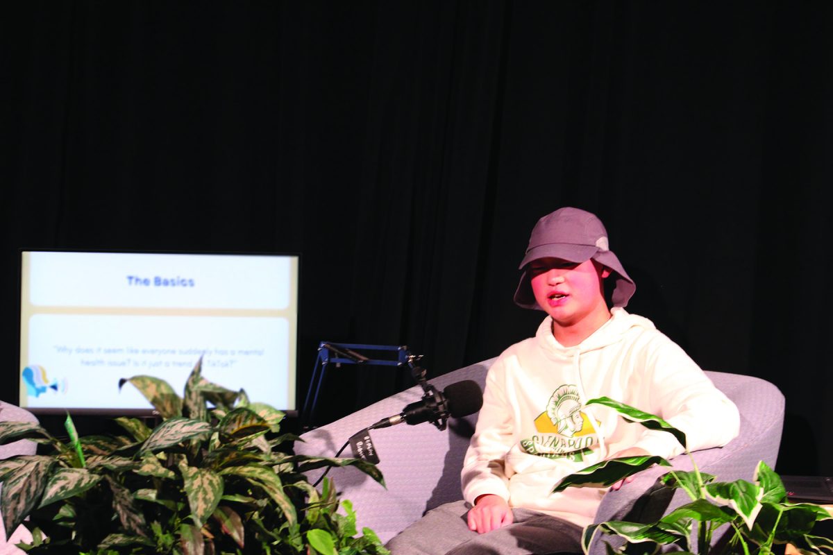 Recording a “Call Out Podcast” episode, junior David Artz addresses common teenage mental health questions on Nov. 14 in the Glenbrook North broadcasting studio. The podcast is available on Spotify and Youtube, and new episodes are released on Fridays.