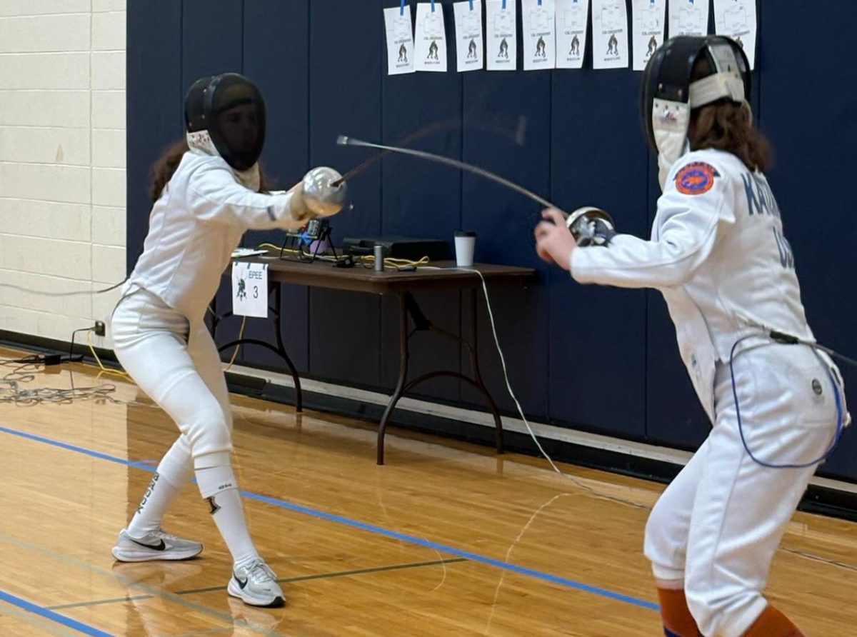 At the Great Lakes Team Championships on Jan. 31, sophomore Zara Dibra (left) participates in a bout. GBN beat the Libertyville and Vernon Hills High School fencing team with a total of 29 touches.