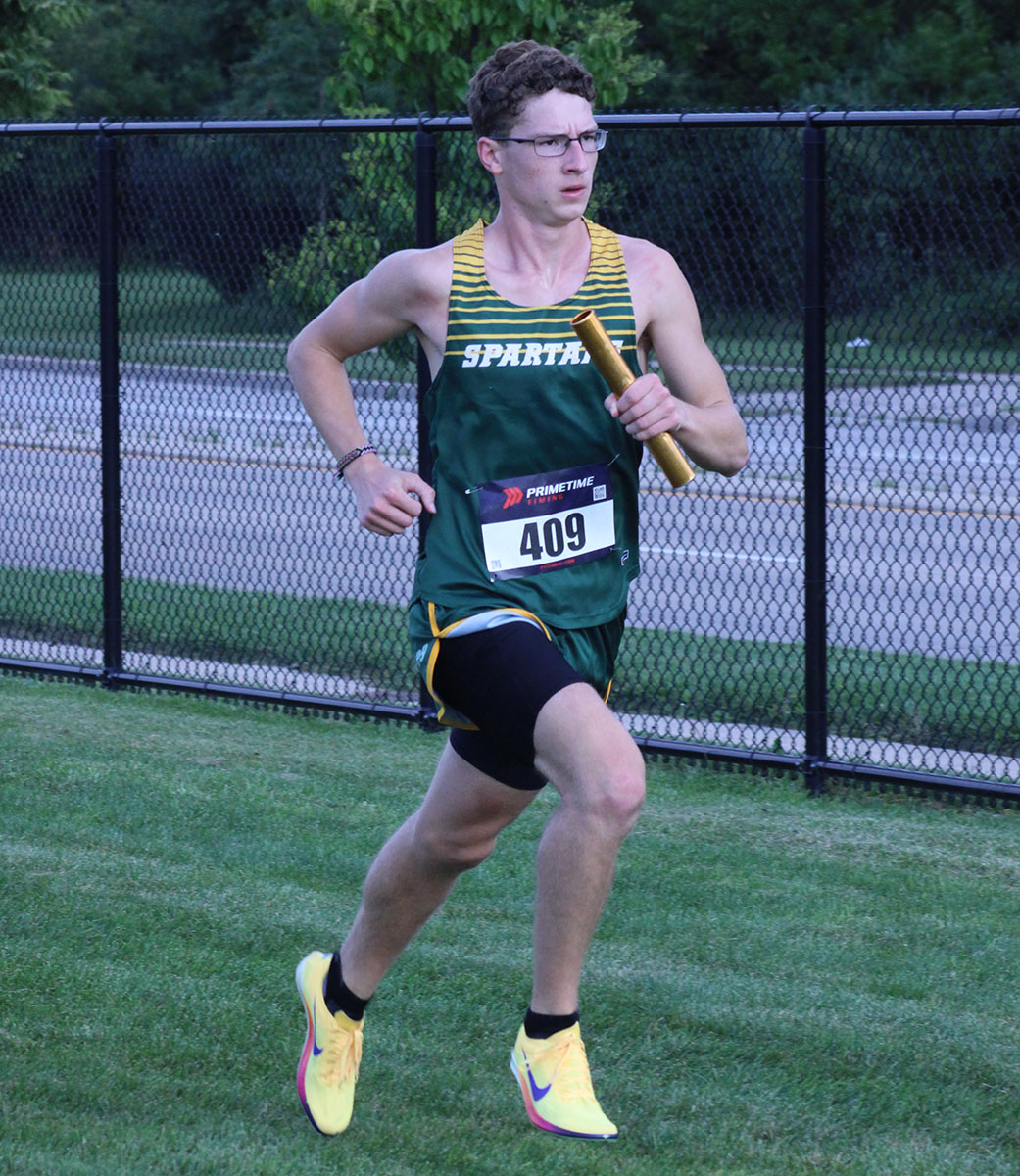 Junior Andrew Wetter competes in the 4-mile relay at The Brooks Dual meet. Glenbrook North won 25-33 against Glenbrook South at GBS on Aug. 25.